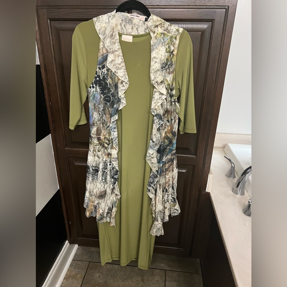Hold Zadieb’s pistachio green layering dress and oragomi vest bundle!